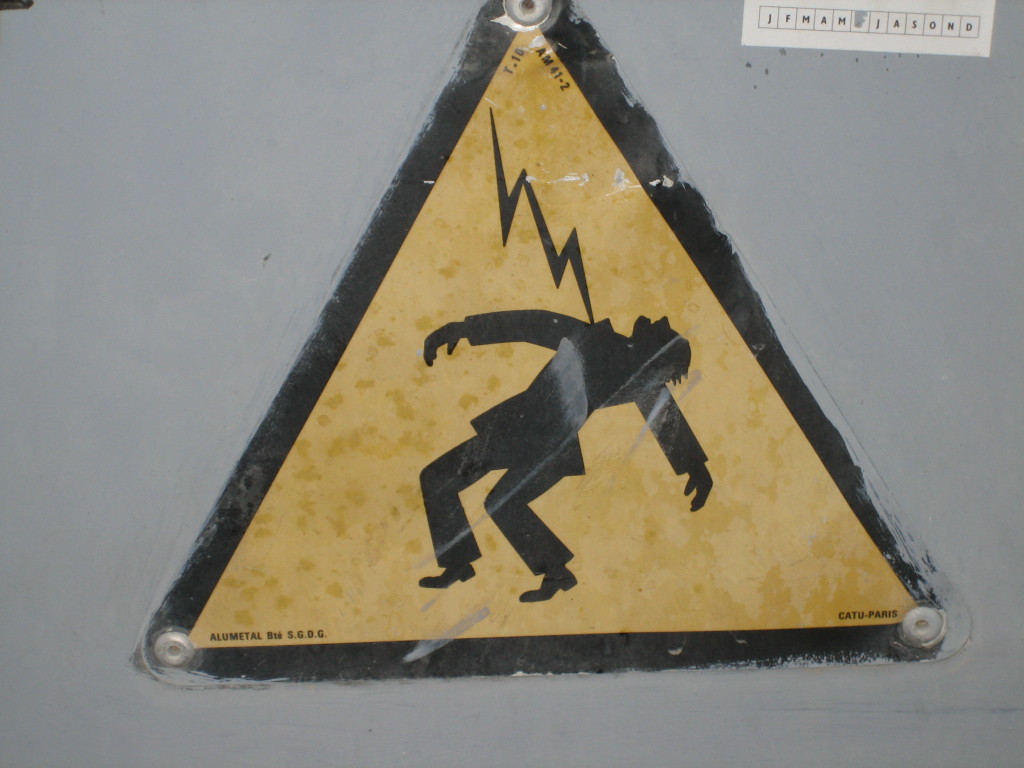 Even the guy on this French warning sign is wearing a stylish outfit